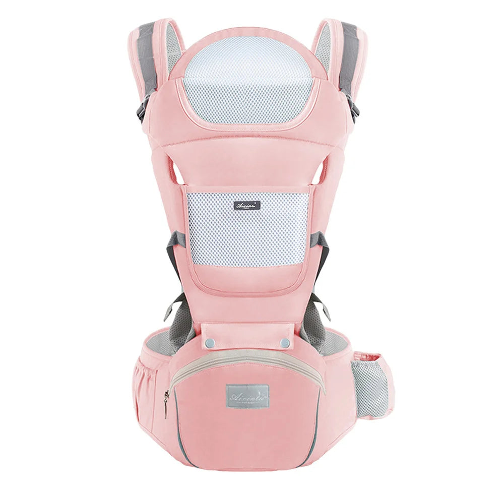Pink ergonomic baby carrier front view with mesh panel and hip seat with zippered pocket.