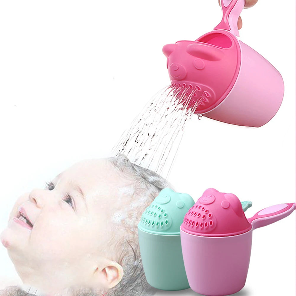Light pink baby bath rinse cup pouring water gently over toddler's head, with light blue cup beside.