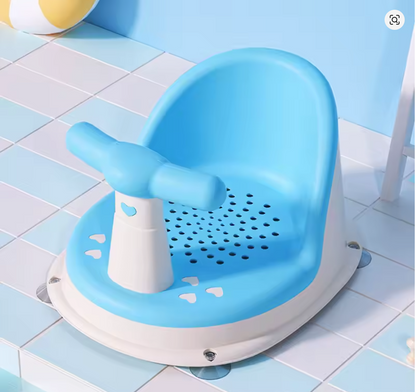 Blue Comfy Baby Bath Seat on tiled floor with bath ball nearby.