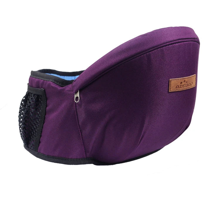Purple ergonomic baby hip seat carrier side view with mesh pocket, zipper, and logo patch.