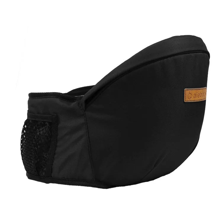 Black ergonomic baby hip seat carrier side view with mesh pocket and logo patch.