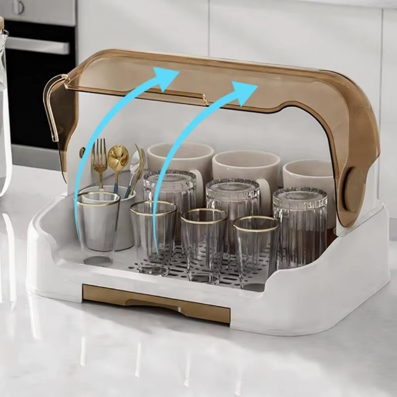 White baby bottle drying rack with open brown lid showing airflow vents and holding glasses and utensils.