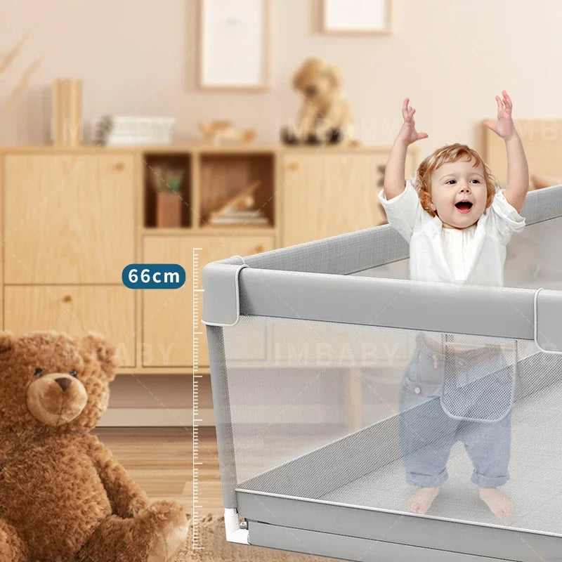 Child standing inside gray baby playpen showing 66cm height with teddy bear nearby.