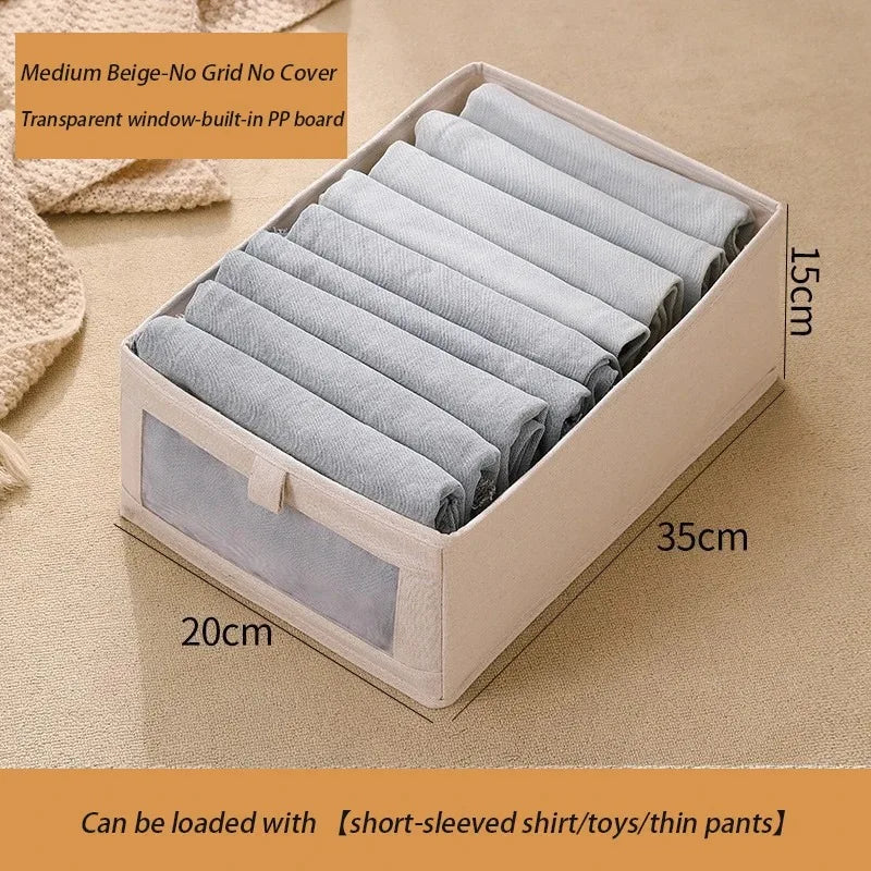 Medium beige foldable fabric storage box with clear window for baby clothes organizer.