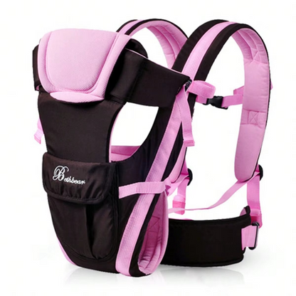 Pink and black ergonomic baby carrier side view with adjustable straps and padded support.