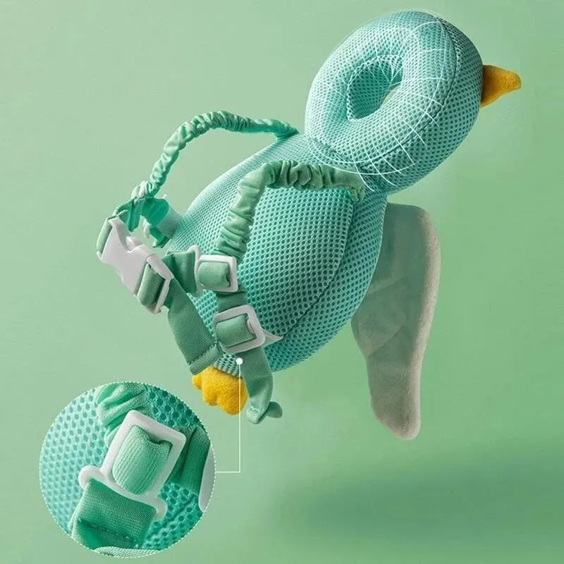 Mint owl baby head protection pillow backpack side view with adjustable chest straps and buckles.