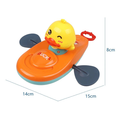 Orange duck kayak bath toy with blue paddles and size dimensions.