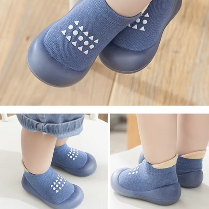 Baby wearing blue breathable soft sole walking shoes shown from multiple angles on wooden floor.