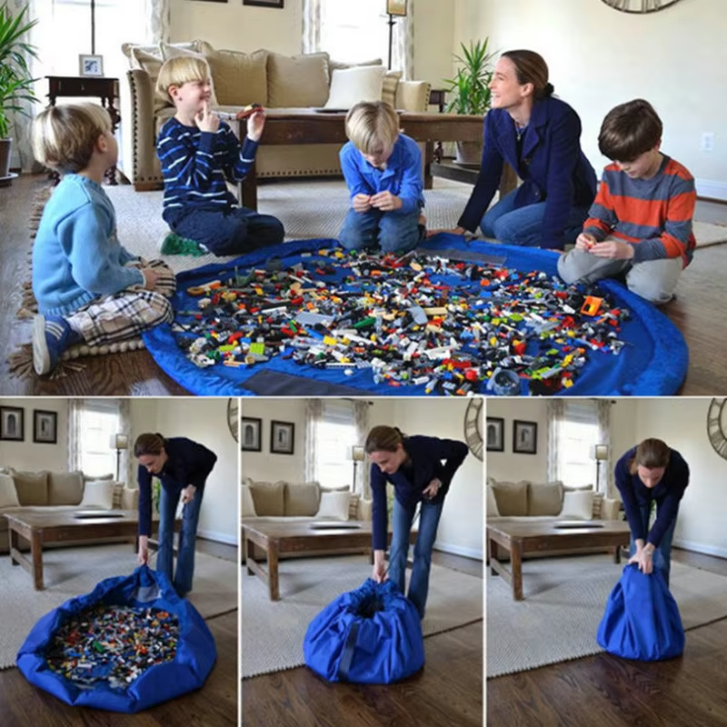 Blue portable toy storage play mat bag used as play surface and drawn up into storage bag by adult.