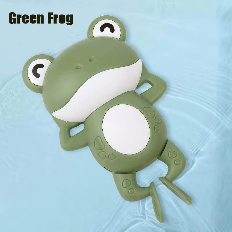 Baby Clockwork Bath Toy green frog floating on water with white belly.