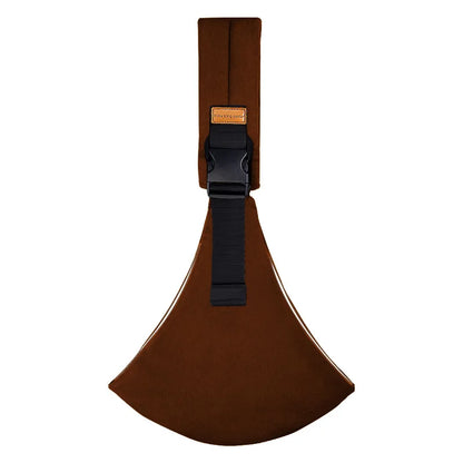 Brown adjustable baby carrier wrap with buckle and strap flat lay.