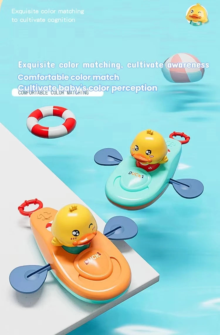 Orange and blue duck kayak bath toys on white platform with bath accessories.