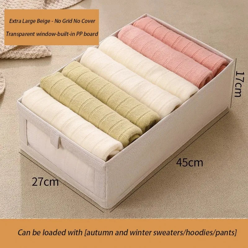 Extra large beige foldable fabric storage box with clear window for baby clothes storage.