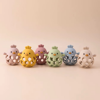 Set of six silicone baby teether rattles in assorted colors lined up.