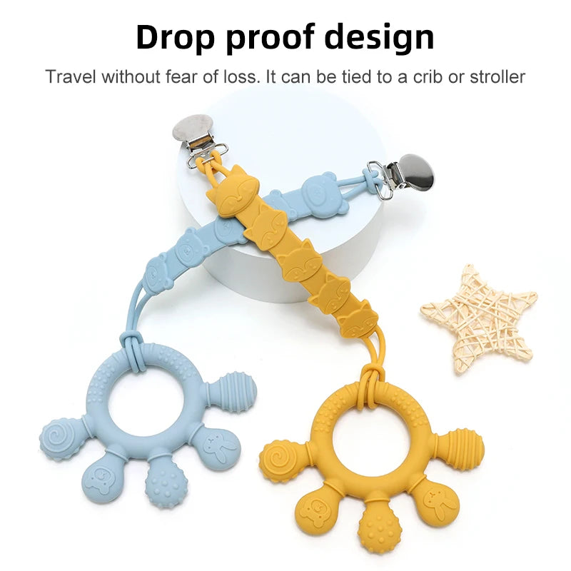 Blue and yellow silicone baby teething rings with clips for attaching to stroller or crib.