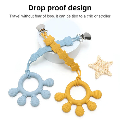 Blue and yellow silicone baby teething rings with clips for attaching to stroller or crib.