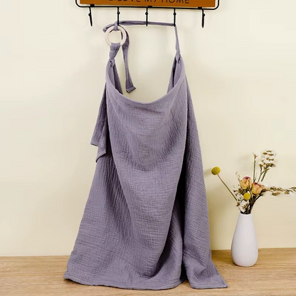 Gray blue breathable muslin nursing cover hanging with adjustable strap and ring detail.