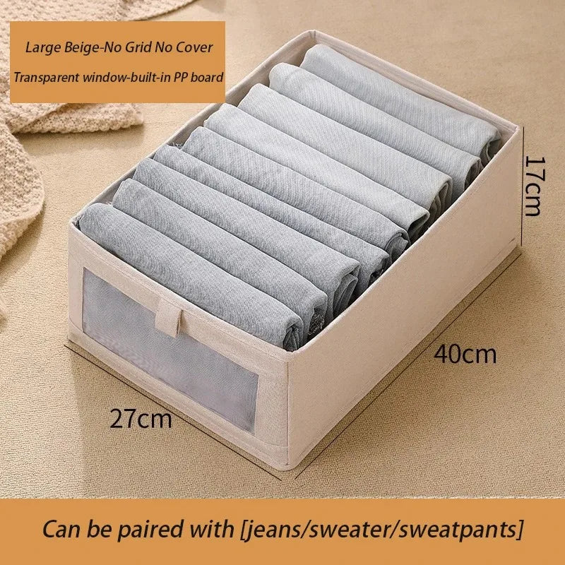 Large beige foldable fabric storage box with clear window for baby clothes storage.