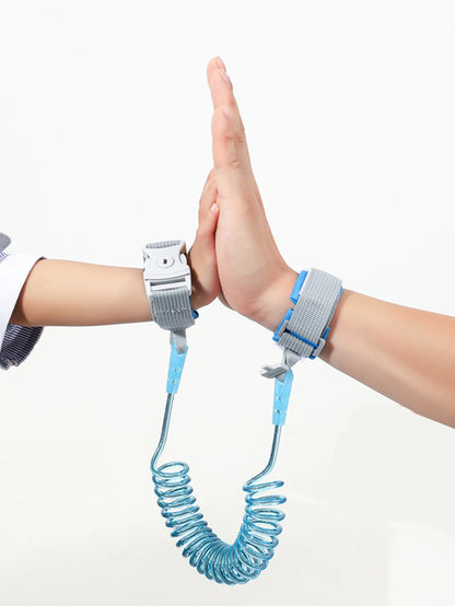 Blue and gray wrist straps connected by blue spring leash for toddler safety.