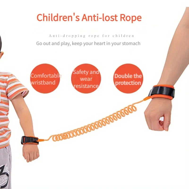 Orange toddler safety leash with padded wristbands worn by child and adult showing anti-lost connection.
