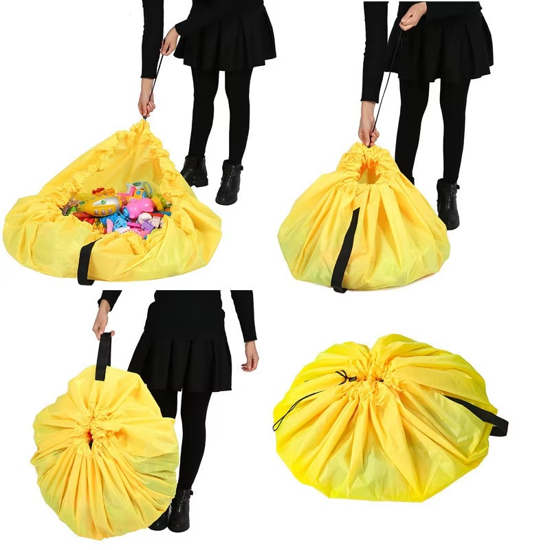 Yellow portable toy storage play mat bag shown open with toys and closed for carrying by person.