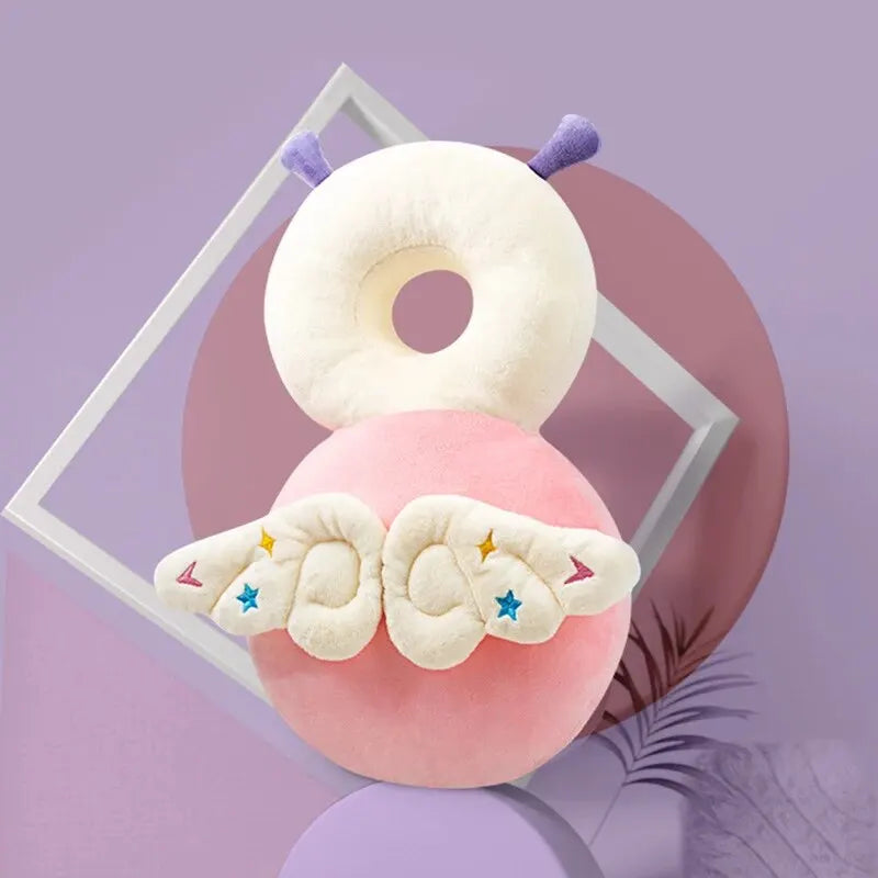 Pink fairy baby head protection pillow backpack with wings on purple decorative background.