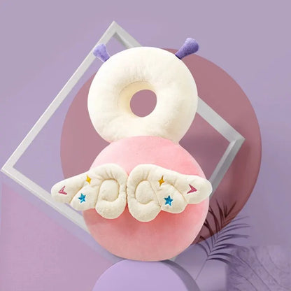 Pink Fairy baby head protection pillow backpack with embroidered wings and antennae, back view.