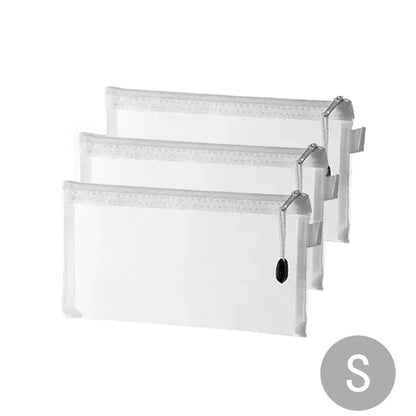 Set of three small transparent mesh zipper toy storage bags stacked.