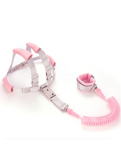 Pink toddler anti-lost safety harness with adjustable straps and 2m spring leash wrist strap.