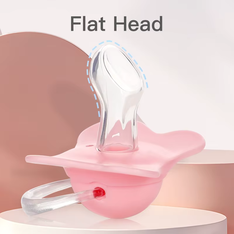 Pink silicone thumb shape baby pacifier close-up showing flat head nipple design.
