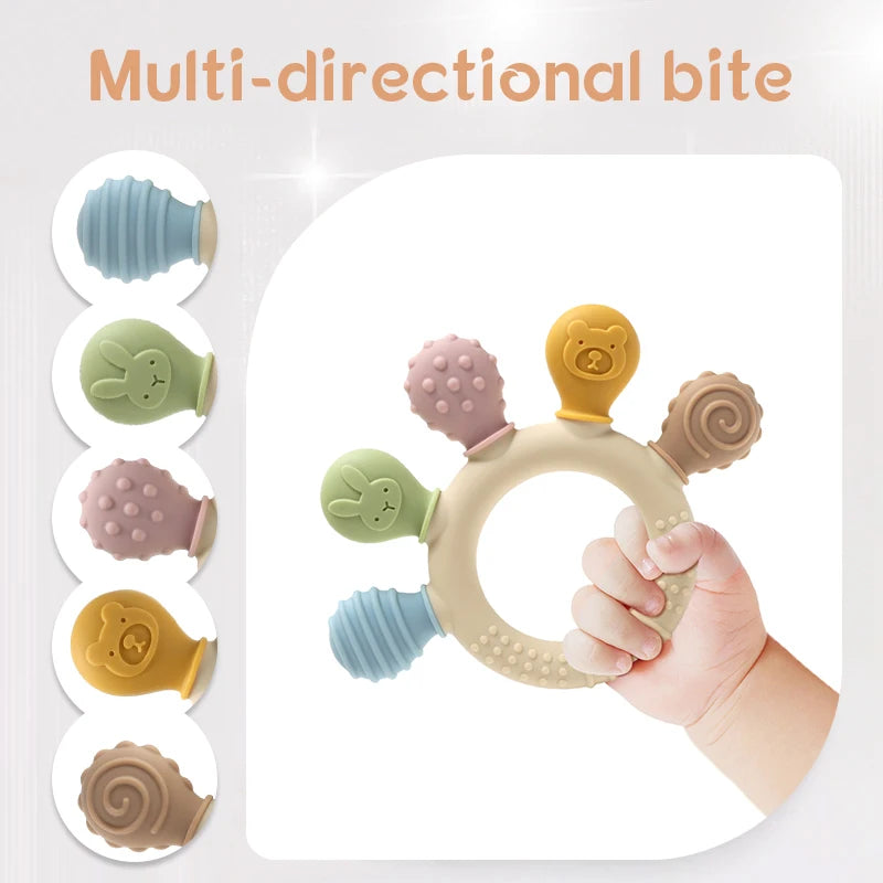 Hand holding pastel silicone baby teething ring with five textured chew heads.