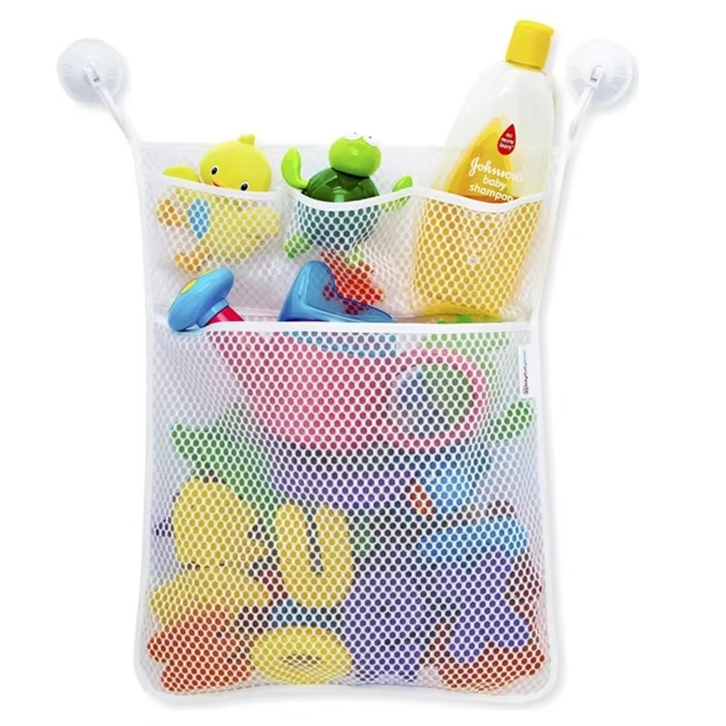 White mesh bath toy organizer with compartments holding shampoo and toys, suction cup mounted.