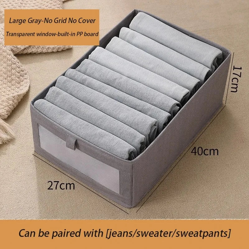 Large gray foldable fabric storage box with clear window for baby clothes storage.