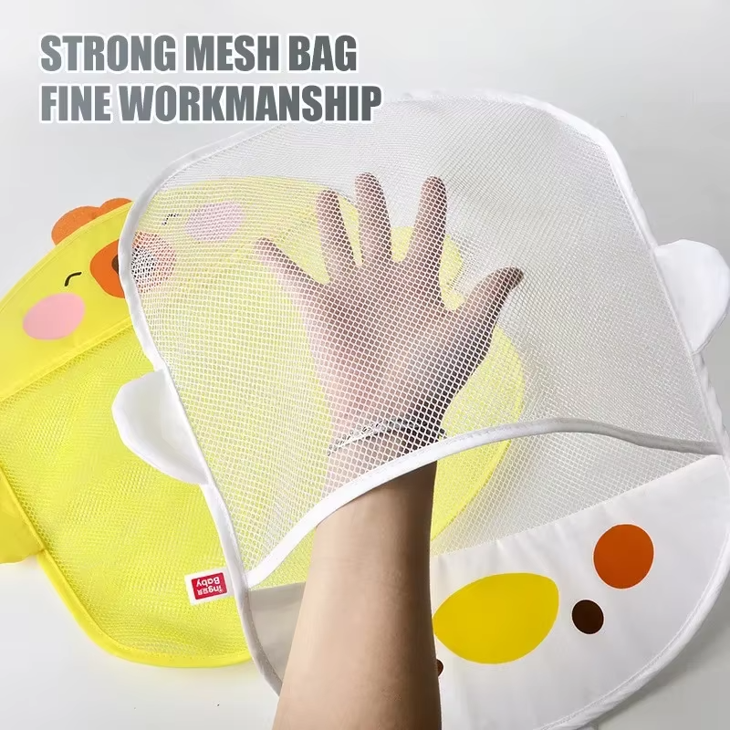 Hand demonstrating strong mesh material of baby bath toy storage bags in yellow and white duck designs.