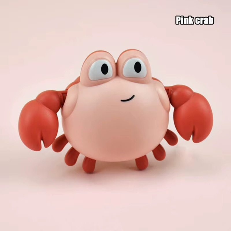 Baby Clockwork Bath Toy pink crab with red claws and wide eyes.