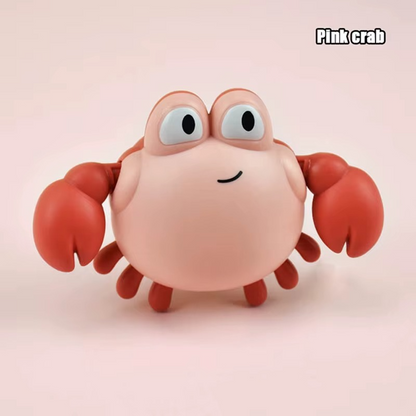 Baby Clockwork Bath Toy pink crab with red claws and wide eyes.