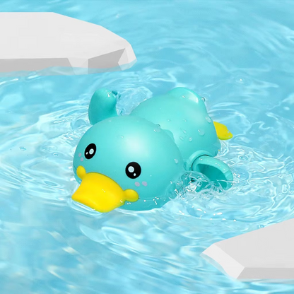 Baby Clockwork Bath Toy green duck swimming in water with yellow beak.
