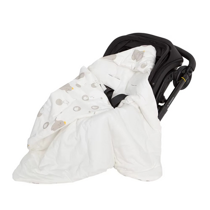 White hooded baby wrap blanket with grey elephant and lion print inside in stroller car seat.