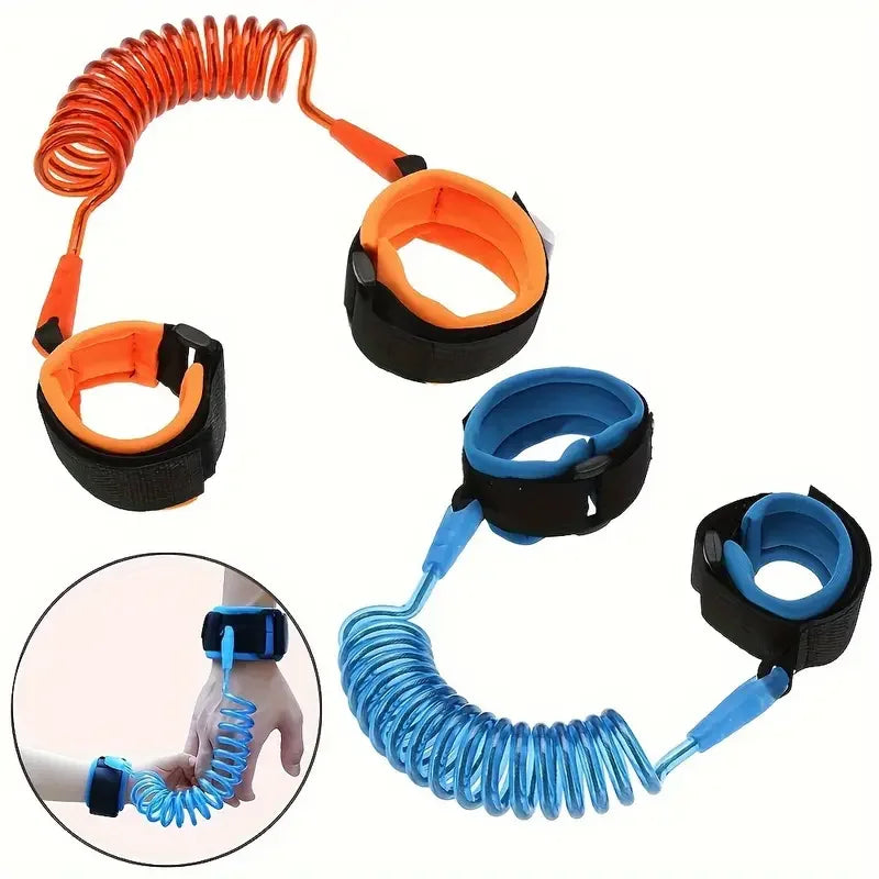 Orange and blue toddler safety leashes with padded wristbands displayed flat and worn on wrists.