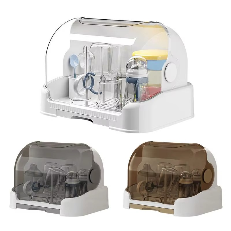 Set of three baby bottle drying racks in white with clear, gray, and brown dustproof lids.