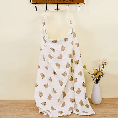 Bear head print breathable muslin nursing cover hanging with adjustable strap and wooden ring.