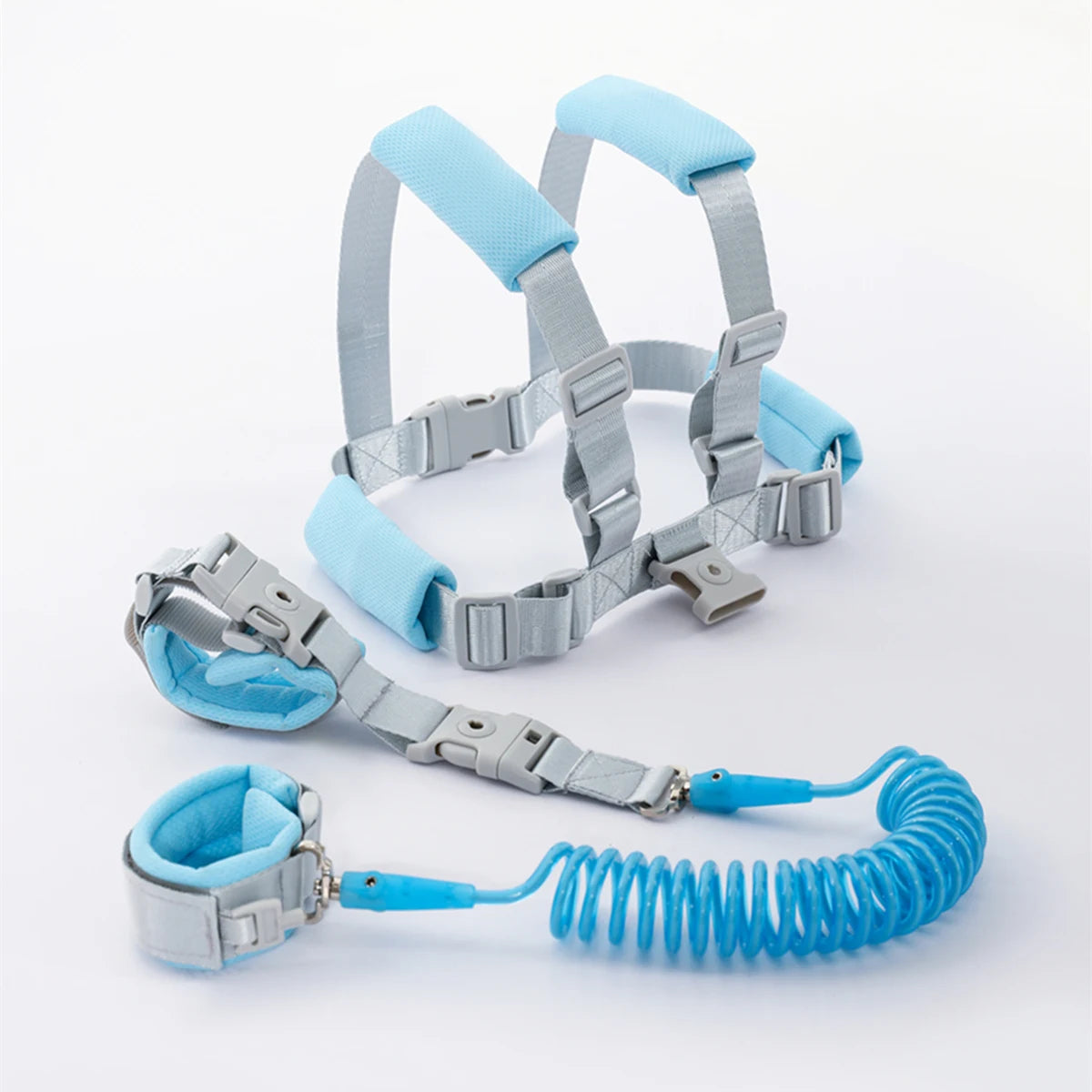 Blue toddler anti-lost safety harness and 2m spring leash wrist strap laid flat.