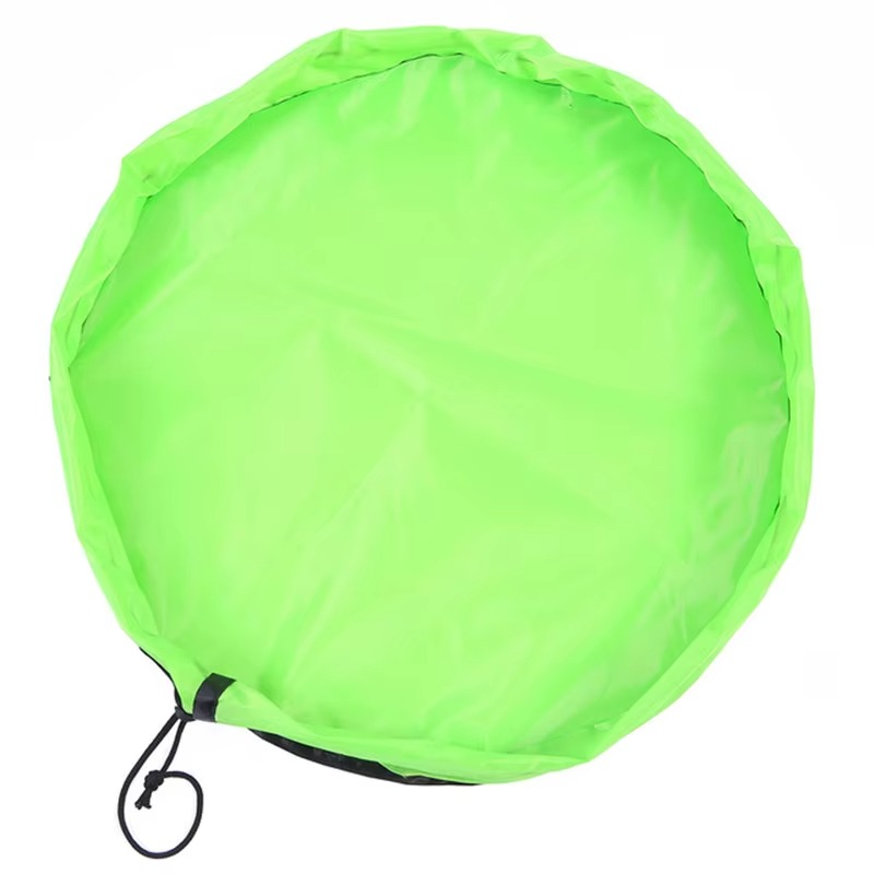 Green foldable portable toy storage play mat bag with drawstring closure laid flat.