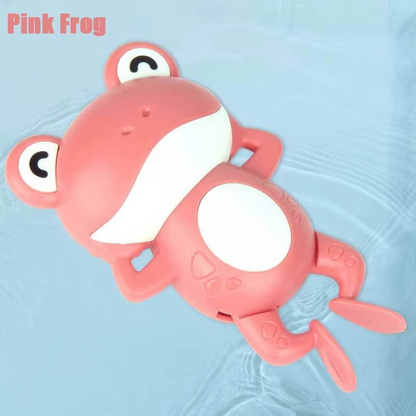 Baby Clockwork Bath Toy pink frog floating on water with white belly.
