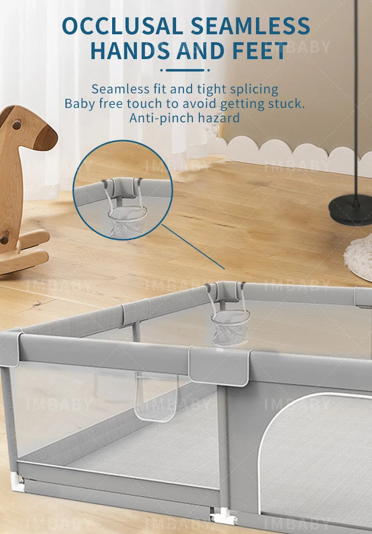 Gray baby playpen close-up on seamless joints and pull ring for safety.
