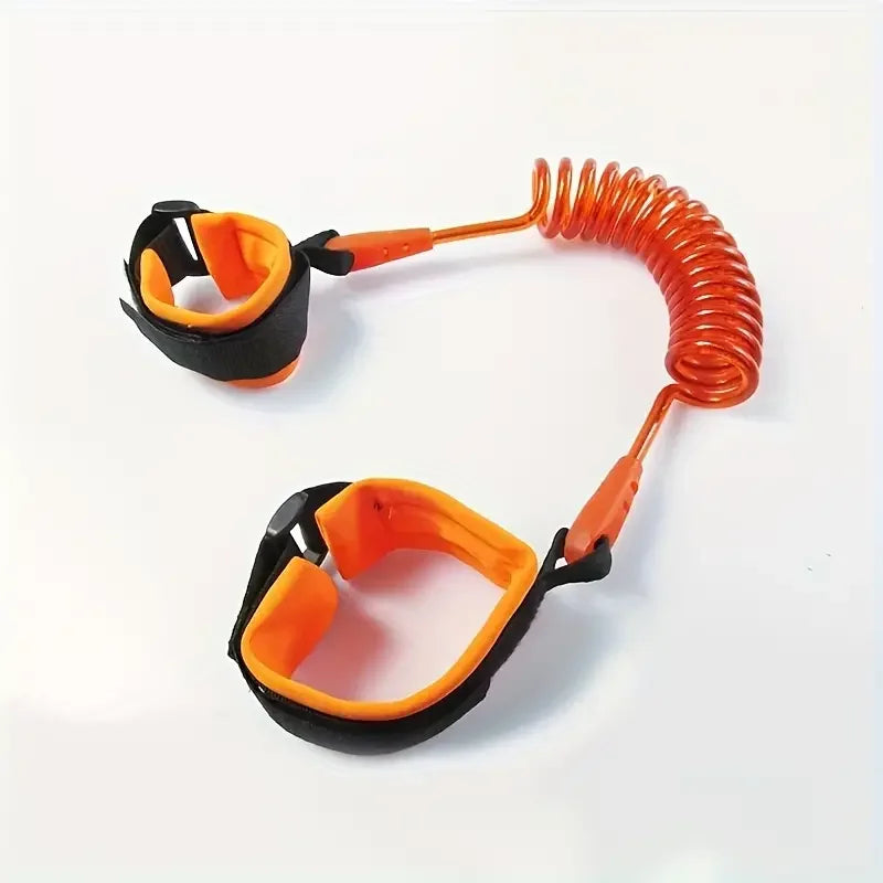 Orange child safety anti lost wrist link with padded wristbands on white background.