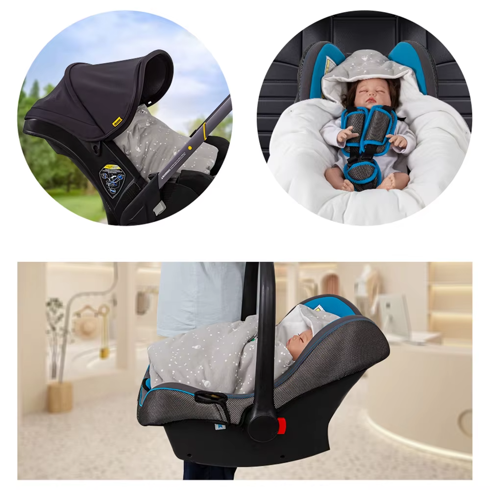 Grey star print hooded baby wrap blanket used in infant car seat with baby inside.