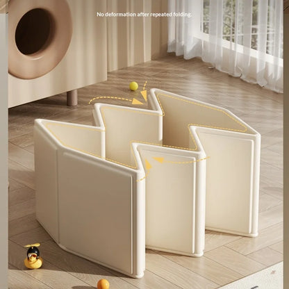 Foldable baby bathtub partially folded in zigzag shape on wooden floor with toy duck.