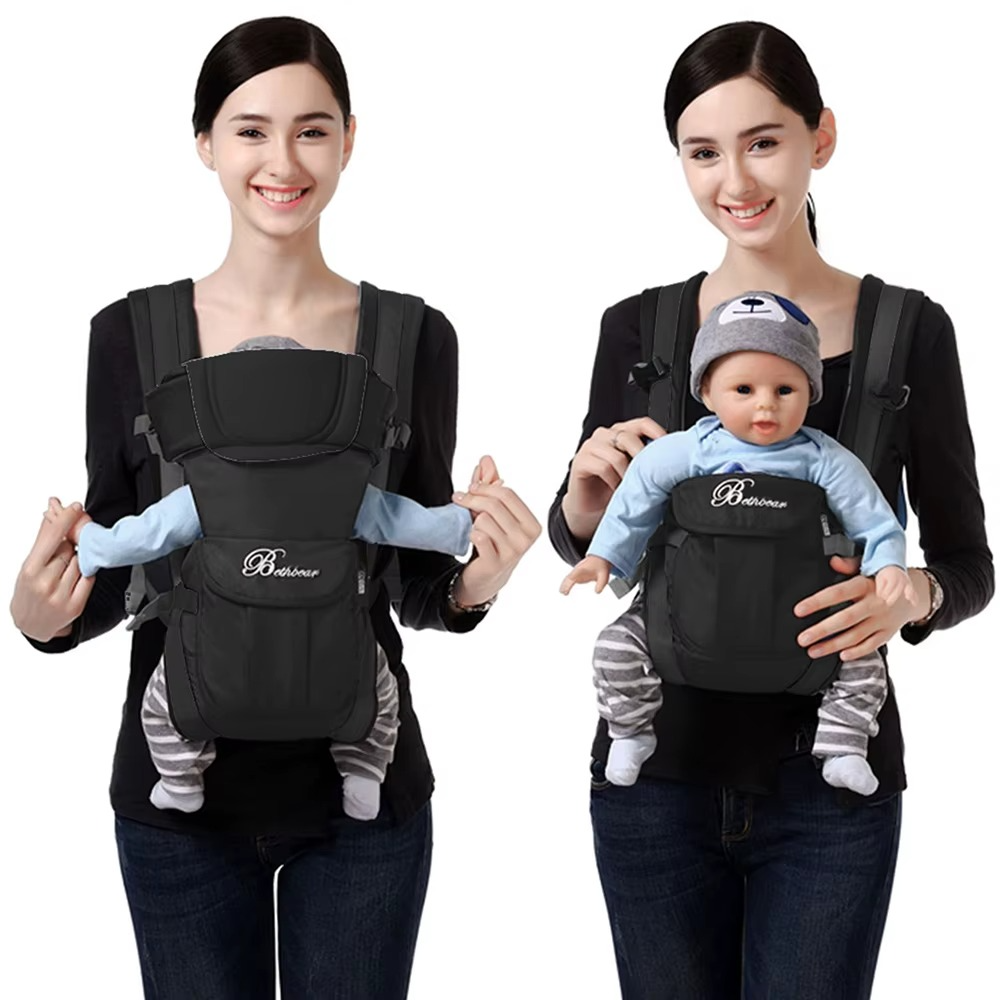 Black ergonomic 4-in-1 baby carrier worn front-facing and inward-facing with baby.