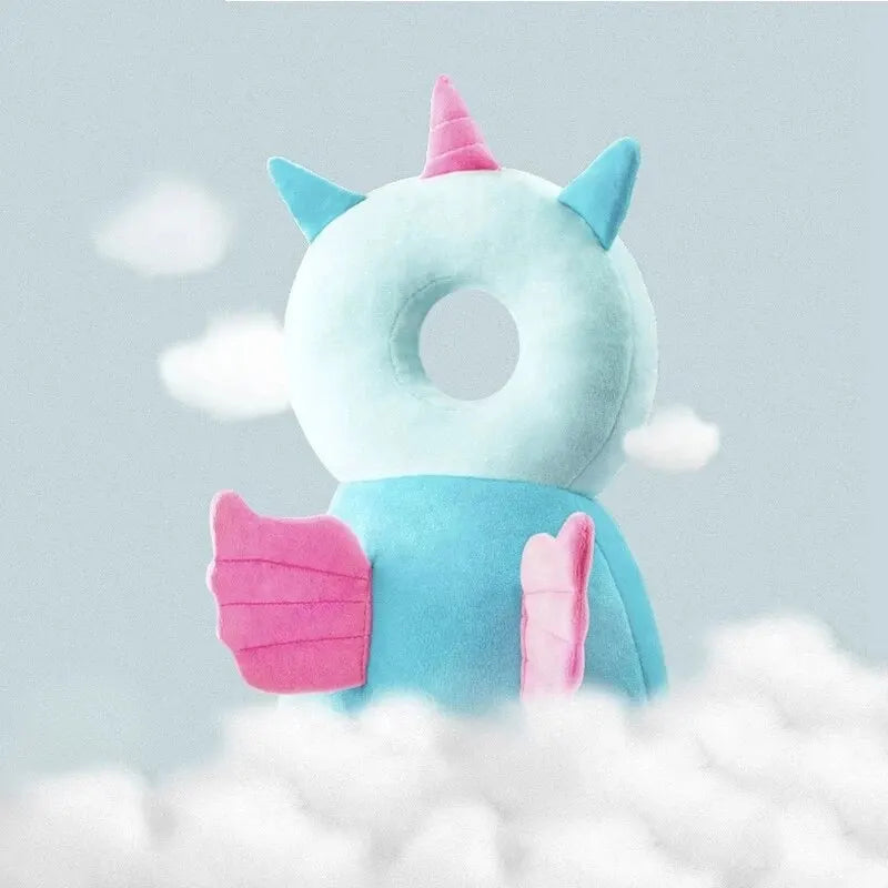 Flying dragon baby head protection pillow backpack with blue and pink wings in cloud setting.